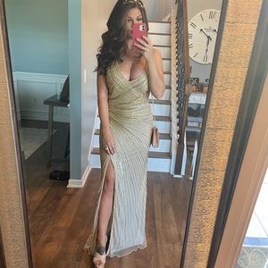 GORGEOUS gold sequin gown with leg slit. Size 10 but back can be adjusted.